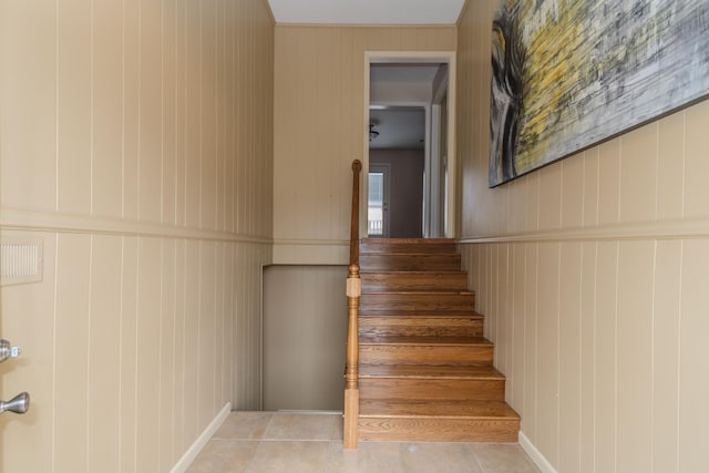 staircase featuring tile patterned floors