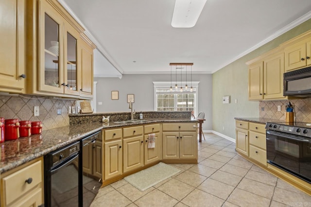 kitchen with ornamental molding, a sink, a peninsula, black microwave, and stove