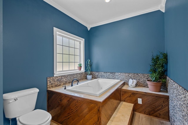 full bathroom with toilet, crown molding, and a garden tub