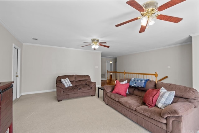 living room with visible vents, light carpet, ornamental molding, a ceiling fan, and baseboards