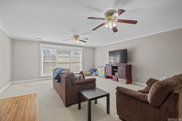 living room with light carpet, ceiling fan, crown molding, and baseboards