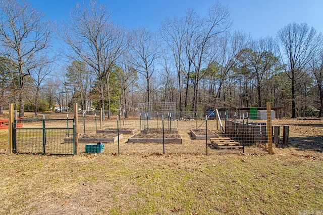 view of yard with a garden and fence