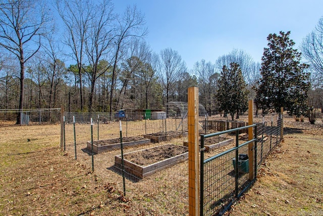 view of yard with a garden and fence