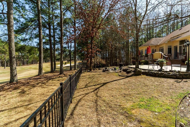 view of yard with a patio and fence