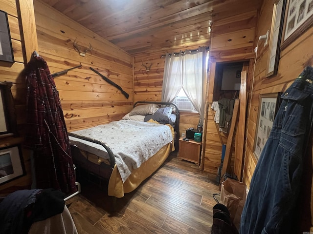 bedroom featuring dark wood-style floors, wood walls, wooden ceiling, and cooling unit