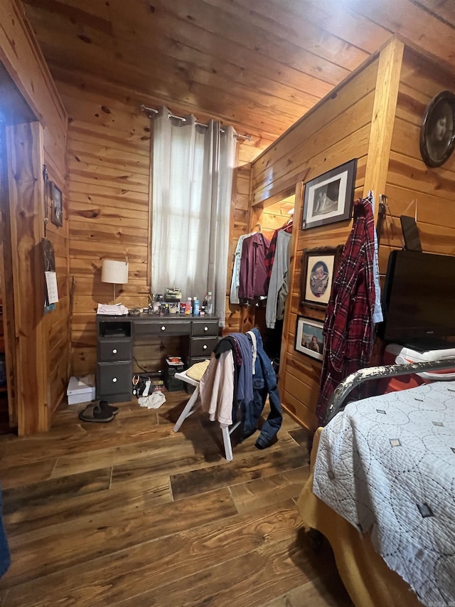 bedroom featuring wooden ceiling, wooden walls, and wood finished floors