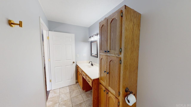 bathroom featuring tile patterned flooring and vanity