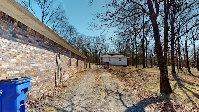 view of home's exterior featuring driveway