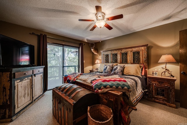 bedroom with light colored carpet, a textured ceiling, and access to outside