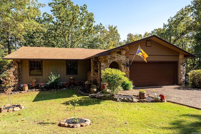 single story home with a shingled roof, a front yard, a garage, stone siding, and driveway