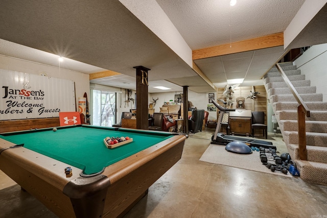 playroom with concrete floors and billiards