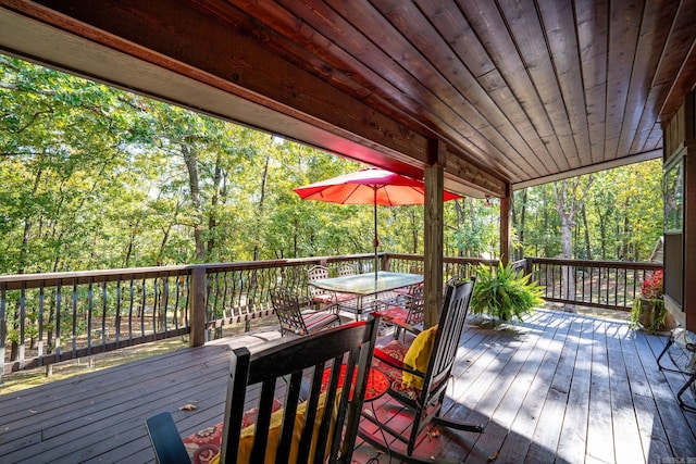 wooden deck featuring outdoor dining area