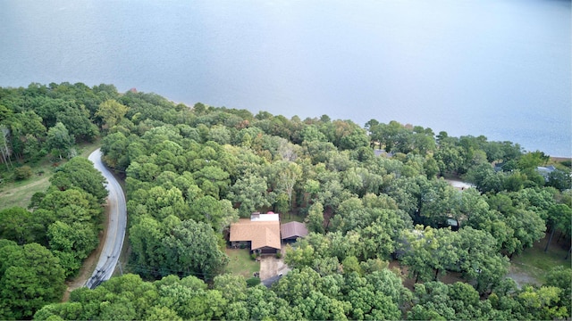 drone / aerial view featuring a wooded view