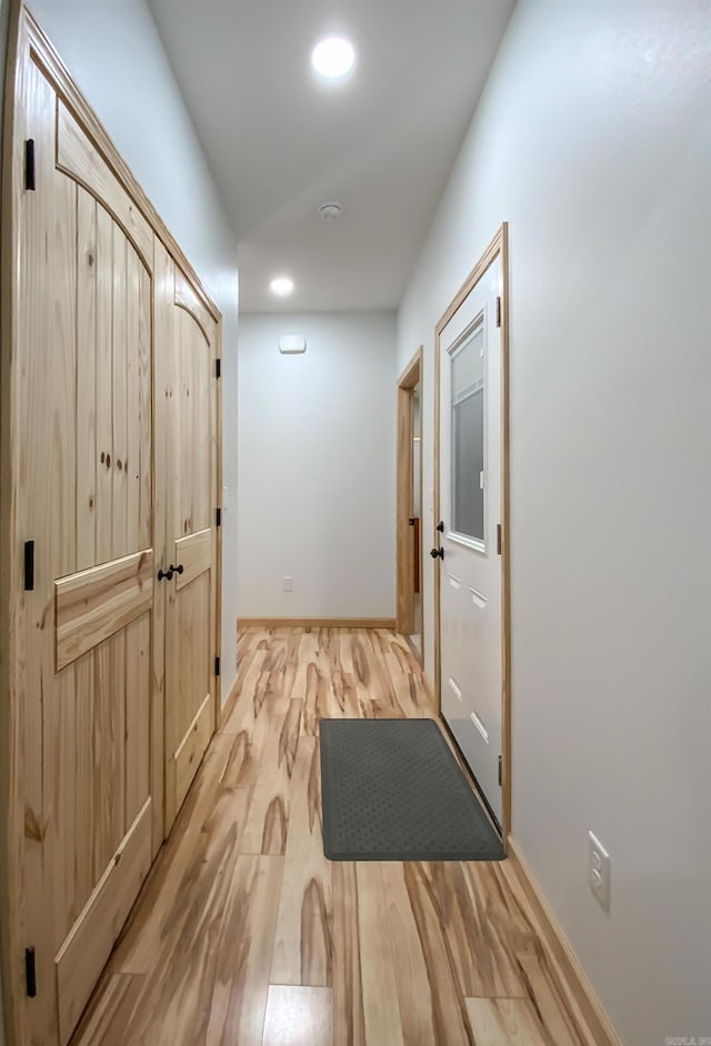 corridor with recessed lighting and light wood-type flooring