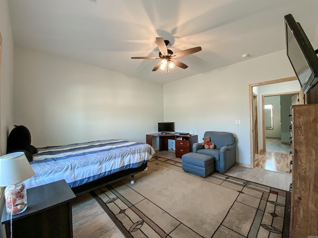 bedroom with light wood finished floors and ceiling fan