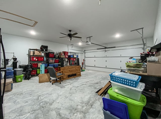 garage featuring a garage door opener and a ceiling fan