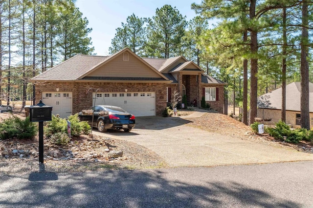 view of front of property with concrete driveway, a garage, and roof with shingles