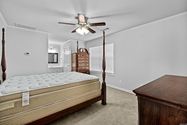 bedroom featuring light carpet, visible vents, ensuite bath, and ornamental molding