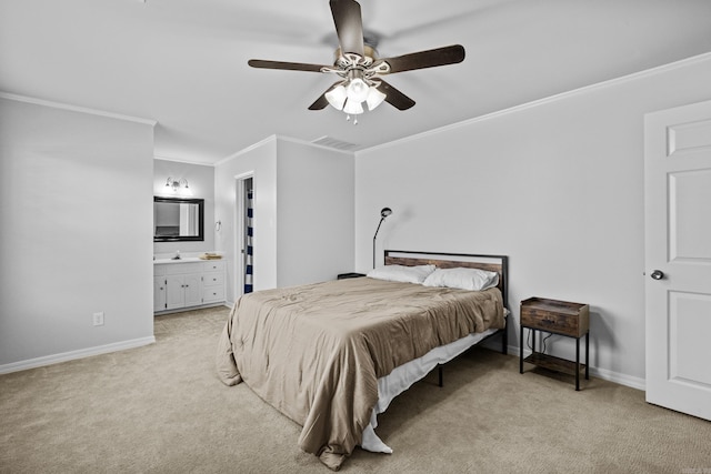 bedroom featuring a sink, baseboards, light colored carpet, and crown molding