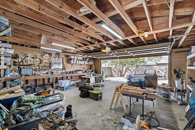 miscellaneous room with a workshop area and concrete flooring