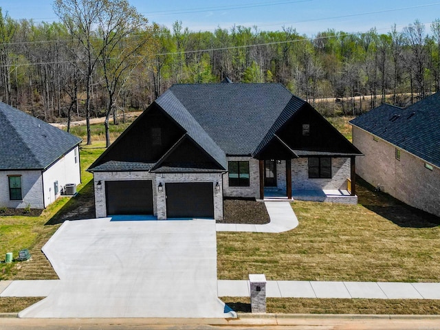 modern inspired farmhouse with a front lawn, central AC unit, a garage, and driveway