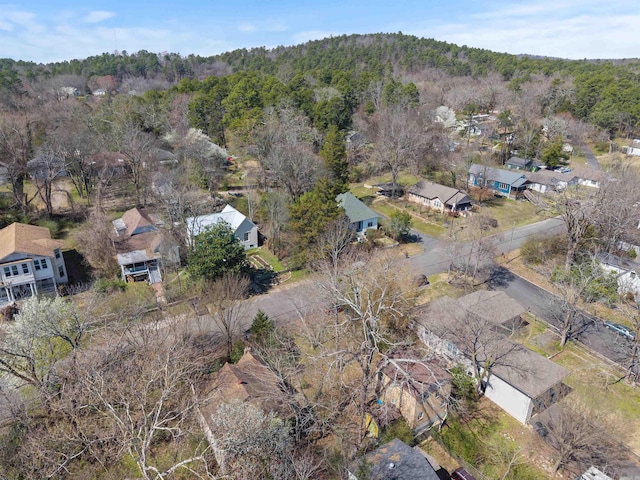 drone / aerial view featuring a forest view