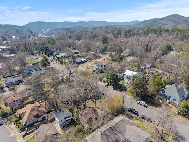 birds eye view of property with a forest view and a mountain view