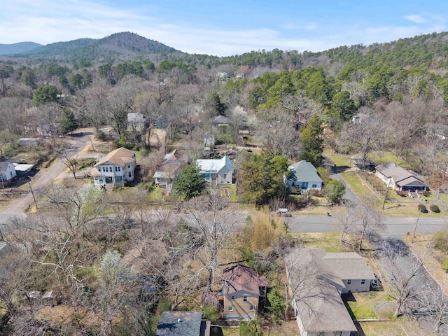 aerial view featuring a forest view and a mountain view