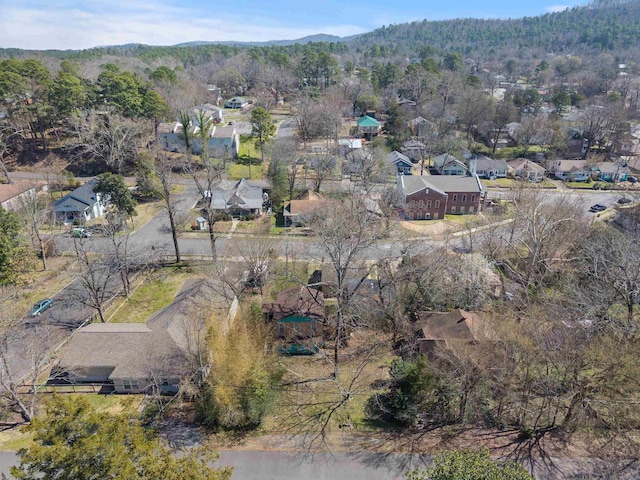 birds eye view of property featuring a wooded view