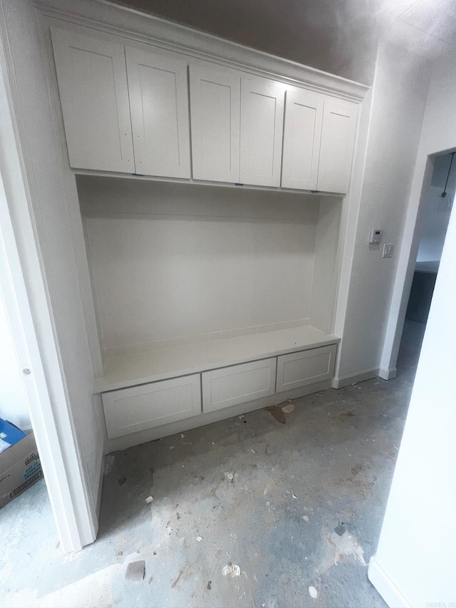 mudroom with concrete flooring