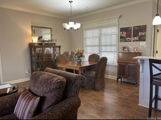 dining room featuring baseboards, visible vents, dark wood-style flooring, ornamental molding, and a notable chandelier