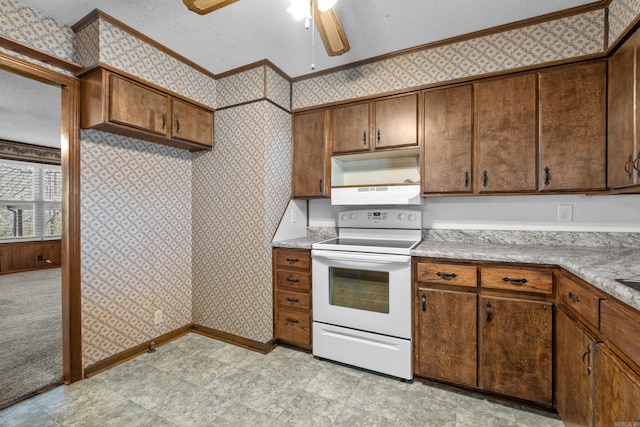 kitchen with wallpapered walls, a textured ceiling, ornamental molding, and white range with electric stovetop