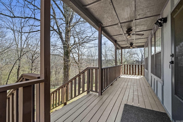 wooden deck with a ceiling fan