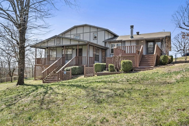 split level home with a front lawn, stairway, and fence