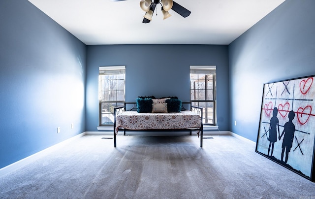 carpeted bedroom featuring a ceiling fan and baseboards