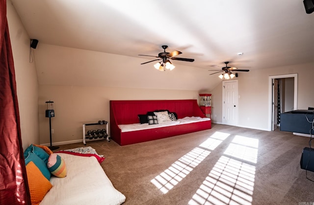 carpeted bedroom featuring baseboards, lofted ceiling, and ceiling fan