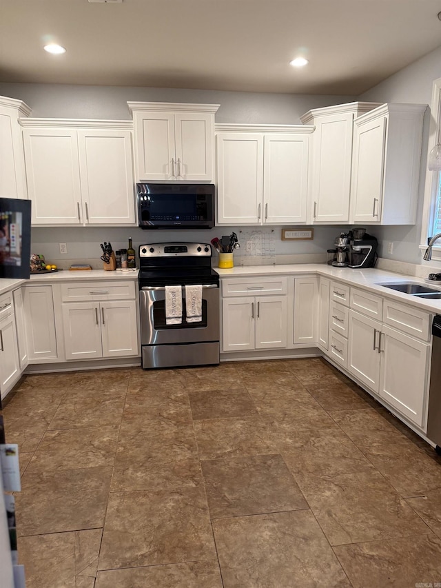 kitchen featuring a sink, light countertops, white cabinetry, and stainless steel appliances