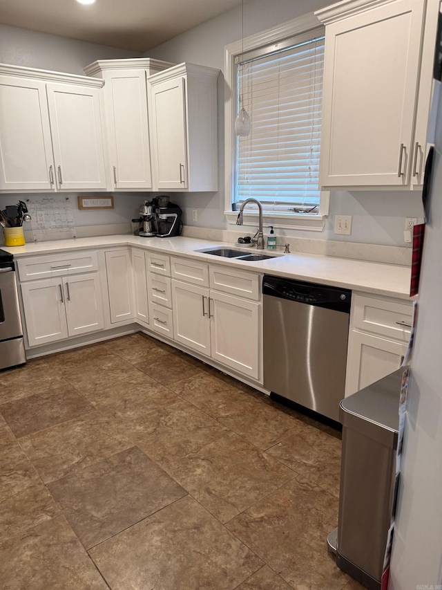 kitchen with backsplash, light countertops, stainless steel dishwasher, white cabinetry, and a sink