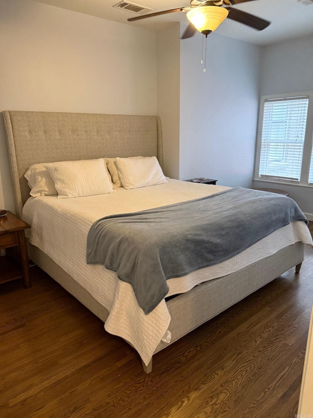 bedroom with ceiling fan and wood finished floors