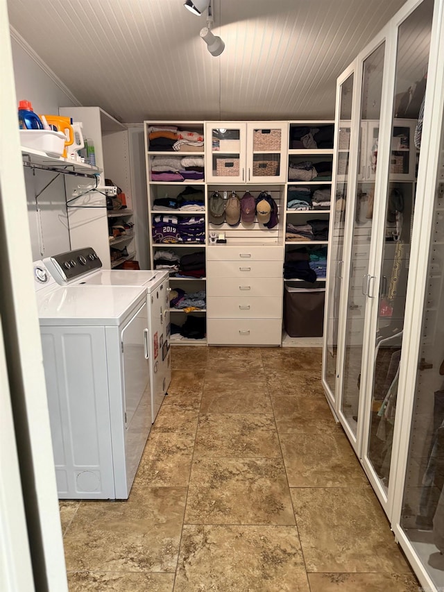 washroom with separate washer and dryer and laundry area