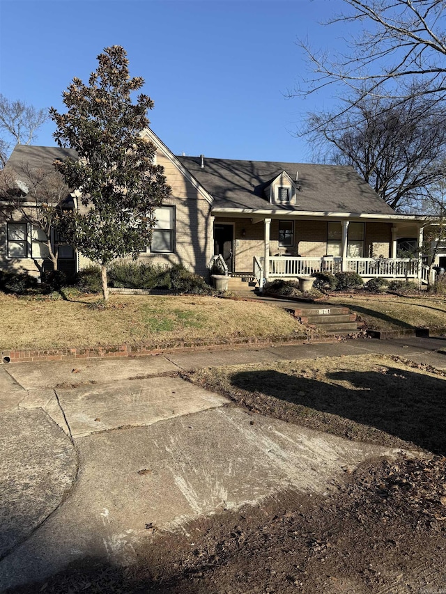 rear view of house with covered porch