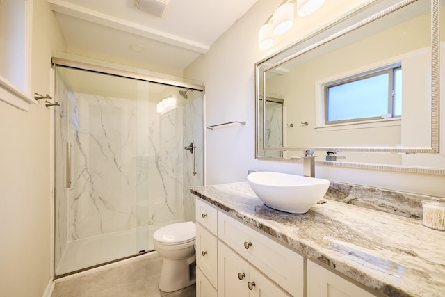 full bathroom featuring vanity, visible vents, a marble finish shower, tile patterned flooring, and toilet