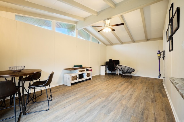 interior space featuring lofted ceiling with beams, light wood-type flooring, and ceiling fan