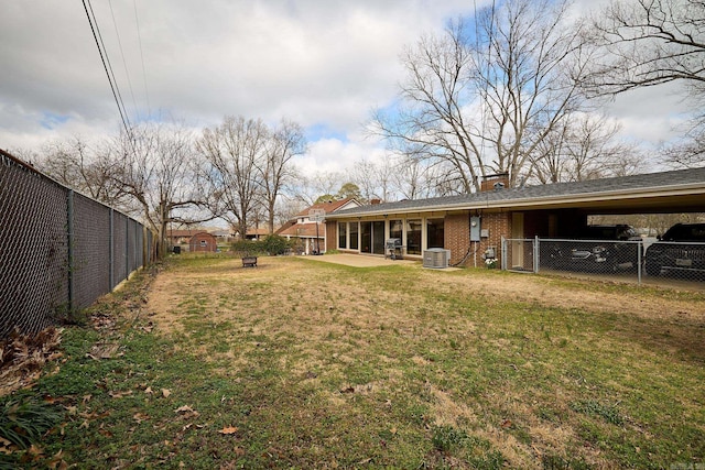 view of yard with cooling unit, a fenced backyard, and a patio area