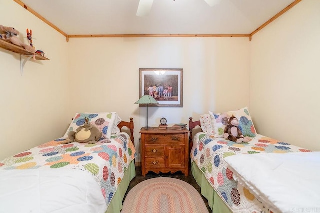 carpeted bedroom with ceiling fan and ornamental molding