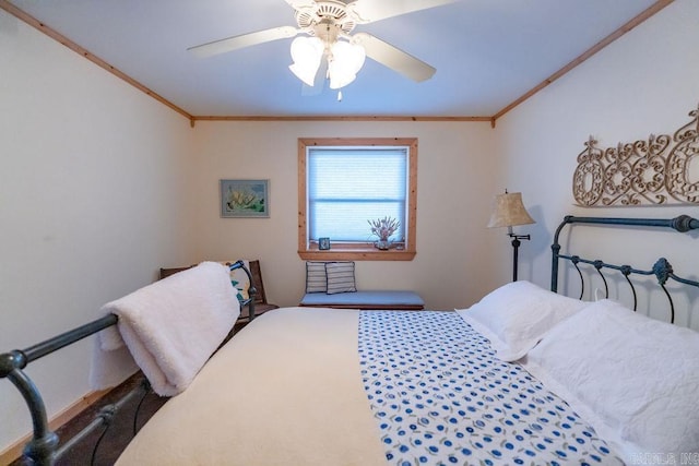 bedroom featuring ornamental molding and a ceiling fan