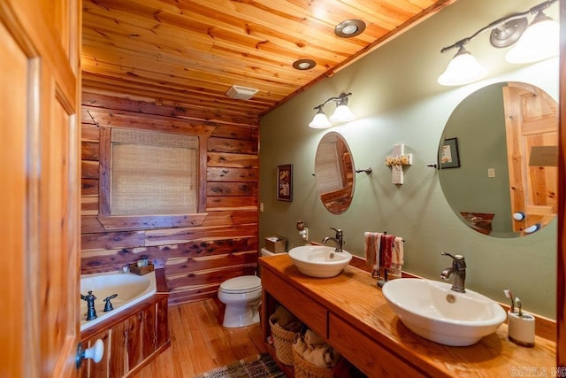 bathroom featuring wooden ceiling, a bath, wood finished floors, and a sink