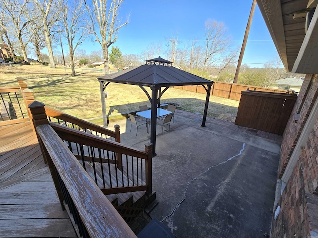 exterior space featuring a gazebo and fence