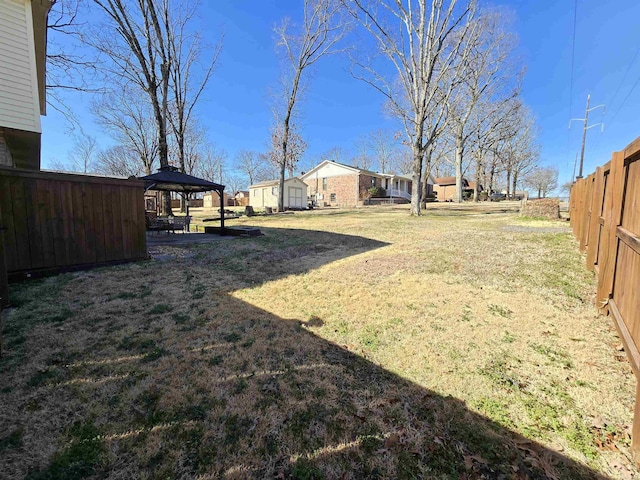 view of yard featuring a gazebo and fence