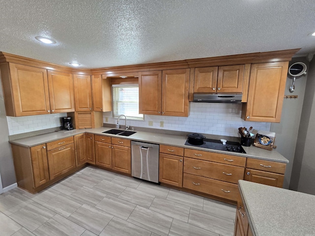 kitchen with a sink, under cabinet range hood, dishwasher, black electric stovetop, and brown cabinets